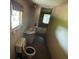 Bathroom featuring dirty fixtures and damaged window at 749 Saddlewood Blvd, Lakeland, FL 33809