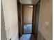 Hallway featuring damaged walls and flooring at 749 Saddlewood Blvd, Lakeland, FL 33809