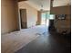 Open floor plan living room leading into kitchen featuring hardwood floor at 749 Saddlewood Blvd, Lakeland, FL 33809