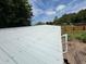 Close-up of the metal roof on the building, with a small section of deck to the side at 749 Saddlewood Blvd, Lakeland, FL 33809