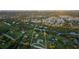 Expansive waterfront property featuring lush greenery, mature trees, and a charming home at 775 Bay Dr, New Smyrna Beach, FL 32168
