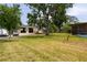 Spacious barn with ample parking and mature trees, perfect for storage or workshop at 775 Bay Dr, New Smyrna Beach, FL 32168