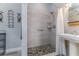 Modern bathroom with walk-in shower, stone floor, and stylish fixtures at 775 Bay Dr, New Smyrna Beach, FL 32168