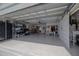Spacious and organized garage with storage and a barn door at 775 Bay Dr, New Smyrna Beach, FL 32168