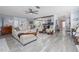 Open concept living room featuring modern flooring and a view of the kitchen at 775 Bay Dr, New Smyrna Beach, FL 32168