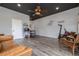 Spacious living room with stylish furnishings, decor, and a ceiling fan at 775 Bay Dr, New Smyrna Beach, FL 32168