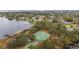 Aerial view of community amenities including tennis courts, basketball court and lake access at 8134 Hook Cir, Orlando, FL 32836