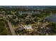 Aerial view of a property in a lakeside community, highlighting the home's position and surroundings at 8134 Hook Cir, Orlando, FL 32836