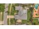 Bird's-eye view of a home showcasing its roof, driveway, backyard and proximity to nearby streets at 8134 Hook Cir, Orlando, FL 32836