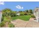 Beautiful backyard with lush greenery and a well-maintained lawn, perfect for outdoor activities at 8134 Hook Cir, Orlando, FL 32836