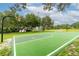 Outdoor basketball court and playground with trees providing shade at 8134 Hook Cir, Orlando, FL 32836