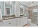 Beautiful bathroom featuring granite counters, dual sinks, and a glass enclosed shower at 8134 Hook Cir, Orlando, FL 32836
