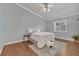 Serene bedroom with hardwood floors, plantation shutters, and a comfortable bed at 8134 Hook Cir, Orlando, FL 32836