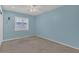 This bedroom features blue walls, shutters, a ceiling fan, and plush carpet at 8134 Hook Cir, Orlando, FL 32836