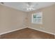 Bright bedroom features a ceiling fan, hardwood floors and shutters allowing for natural light at 8134 Hook Cir, Orlando, FL 32836