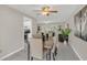 Inviting dining room with tile floors, contemporary furniture, and plenty of natural light at 8134 Hook Cir, Orlando, FL 32836