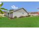 A cozy home with a well-manicured lawn with lots of green grass at 8134 Hook Cir, Orlando, FL 32836