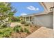 Charming home exterior showcasing manicured garden and landscaping at 8134 Hook Cir, Orlando, FL 32836