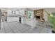 Open concept kitchen with white cabinets, stone counters, and bar seating at 8134 Hook Cir, Orlando, FL 32836