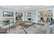 Open concept living area featuring views into the dining area and sun room at 8134 Hook Cir, Orlando, FL 32836