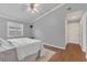 Comfortable bedroom featuring a ceiling fan and hardwood floors, bathed in natural light at 8134 Hook Cir, Orlando, FL 32836