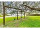 Playground swings beneath moss-draped trees near the water at 8134 Hook Cir, Orlando, FL 32836