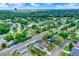 An aerial view reveals homes with pools, spacious yards, and mature trees in a tranquil residential area at 840 Baybreeze Ln, Altamonte Springs, FL 32714