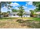 Spacious backyard with patio, fire pit, mature trees, and a privacy fence at 840 Baybreeze Ln, Altamonte Springs, FL 32714