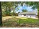 Large backyard with trees, a patio, and perimeter wood privacy fence at 840 Baybreeze Ln, Altamonte Springs, FL 32714