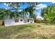 Backyard featuring a patio, mature trees, and a well-maintained lawn at 840 Baybreeze Ln, Altamonte Springs, FL 32714