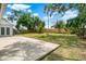 Spacious backyard features a concrete patio, a fire pit, and a privacy fence at 840 Baybreeze Ln, Altamonte Springs, FL 32714