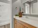 Bright bathroom with wood cabinets and a mirror above the sink at 840 Baybreeze Ln, Altamonte Springs, FL 32714