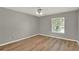 Bedroom featuring wood-look floors, neutral paint, with a window and fan at 840 Baybreeze Ln, Altamonte Springs, FL 32714