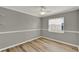 Cozy bedroom featuring wood-look floors, neutral paint, and a ceiling fan at 840 Baybreeze Ln, Altamonte Springs, FL 32714