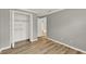 Neutral bedroom featuring wood floors, gray paint, a closet, and white trim at 840 Baybreeze Ln, Altamonte Springs, FL 32714