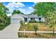 Charming single-story home with a well-maintained front yard and attached garage, perfect for Gathering living at 840 Baybreeze Ln, Altamonte Springs, FL 32714