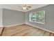 Comfortable living area with wood-look floors, bright window, and neutral tones, offering a relaxing atmosphere at 840 Baybreeze Ln, Altamonte Springs, FL 32714