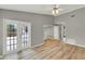 Bright and airy living room features wood floors and double doors that provide ample natural light at 840 Baybreeze Ln, Altamonte Springs, FL 32714