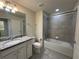 Well-maintained bathroom with granite countertop vanity, tub-shower combo, and modern fixtures at 8930 Zurich Ln, Kissimmee, FL 34747