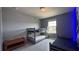 Nicely decorated bedroom featuring bunk beds, tile flooring, and spaceship mural on the wall at 8930 Zurich Ln, Kissimmee, FL 34747