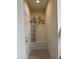 Mud room includes a bench, storage, and bicycle as decor at 8930 Zurich Ln, Kissimmee, FL 34747