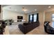 Comfortable living room featuring a cozy sectional sofa, and a modern entertainment center at 8930 Zurich Ln, Kissimmee, FL 34747
