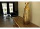 Stylish living room showcasing a modern vase, and a glimpse of a serene outdoor space at 8930 Zurich Ln, Kissimmee, FL 34747
