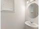 Bathroom with pedestal sink and window at 9425 Holliston Creek Pl, Winter Garden, FL 34787