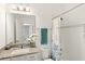 Bathroom featuring granite counters and shower with tub at 9425 Holliston Creek Pl, Winter Garden, FL 34787