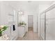 Bright bathroom showcases tiled shower, granite counters and a walk-in closet at 9425 Holliston Creek Pl, Winter Garden, FL 34787