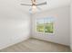 Cozy carpeted bedroom with outdoor view from window at 9425 Holliston Creek Pl, Winter Garden, FL 34787