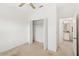 Bedroom featuring closet, carpet, and doorway to bath at 9425 Holliston Creek Pl, Winter Garden, FL 34787