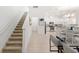 Bright entryway with staircase leads to an open floor plan at 9425 Holliston Creek Pl, Winter Garden, FL 34787