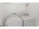 Laundry room featuring white washer and dryer at 9425 Holliston Creek Pl, Winter Garden, FL 34787